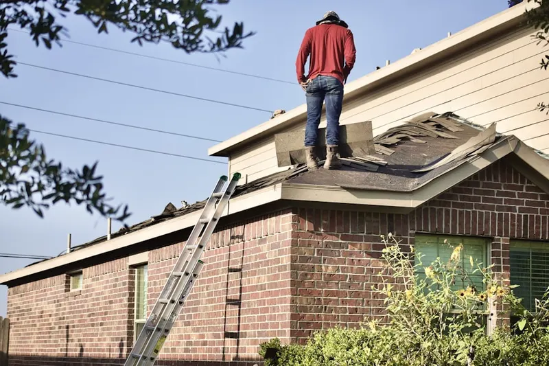 Professional roofer working on a residential roof in Ridgeview Ranch
